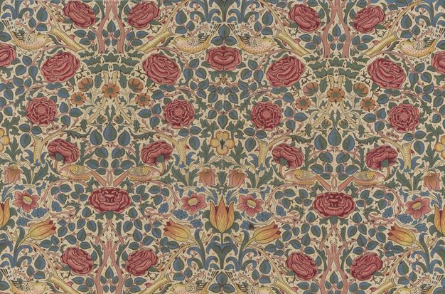 Textile. Deep pink and red, stylized roses are arranged in roughly hourglass-shaped lines against a web of pink and yellow stems, peach-coloured flowers, yellow tulips, birds, and blue and green leaves against an ivory-white background.